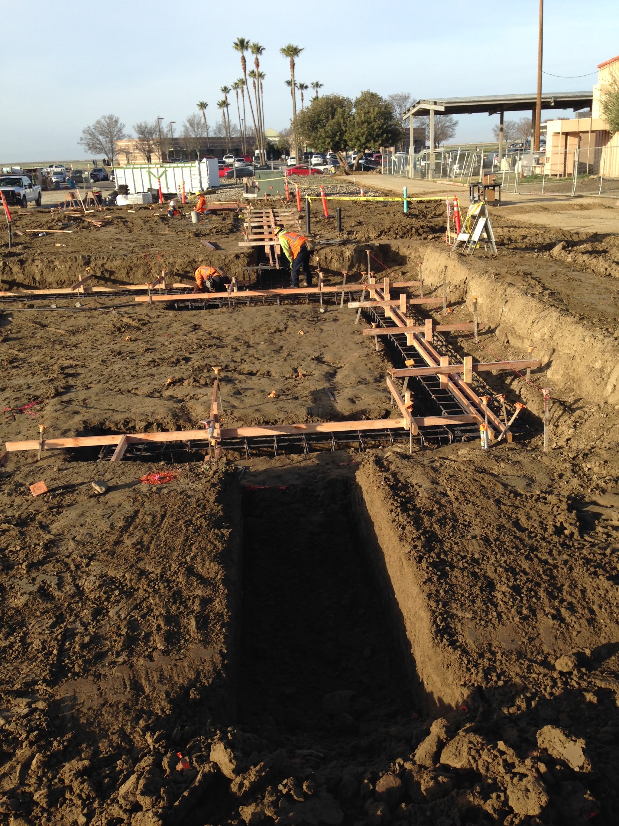 Large-scale commercial foundation trenching with rebar forms laid out